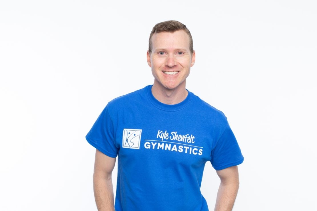 Olympic gymnast Kyle Shewfelt smiling in a professional portrait, featured as a Bagjump testimonial.